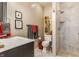 Bathroom with walk-in shower, modern toilet, and decorative towels at 932 N Broadway St # 1, Indianapolis, IN 46202