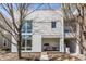Charming home exterior with covered porch and modern architectural details at 932 N Broadway St # 1, Indianapolis, IN 46202