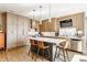 Modern kitchen with sleek cabinets, a central island, and stainless steel appliances at 932 N Broadway St # 1, Indianapolis, IN 46202