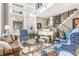 Stylish living room featuring a white piano, high ceilings, and ample natural light at 932 N Broadway St # 1, Indianapolis, IN 46202
