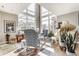 Inviting living room with tall windows, modern decor, and a comfortable seating area at 932 N Broadway St # 1, Indianapolis, IN 46202