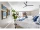 Spacious main bedroom with natural light, modern ceiling fan, and cozy decor, enhancing the inviting atmosphere at 932 N Broadway St # 1, Indianapolis, IN 46202
