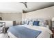 Comfortable main bedroom features a large bed with blue accents, offering a relaxing and stylish retreat at 932 N Broadway St # 1, Indianapolis, IN 46202