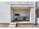 Inviting front porch with comfortable seating and stylish decor elements at 932 N Broadway St # 1, Indianapolis, IN 46202