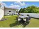 Rooftop deck with artificial turf and dining set, great for outdoor entertaining and relaxation at 932 N Broadway St # 1, Indianapolis, IN 46202