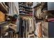 Organized walk-in closet with ample shelving, hanging space, and storage solutions, perfect for maximizing wardrobe space at 932 N Broadway St # 1, Indianapolis, IN 46202