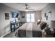 Comfortable bedroom featuring a ceiling fan and a large window for natural light at 9505 Bay Vista W Dr, Indianapolis, IN 46250