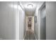 Hallway featuring modern light fixture and barn door at 9505 Bay Vista W Dr, Indianapolis, IN 46250