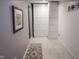 Hallway with tiled flooring and a decorative picture on the wall at 9505 Bay Vista W Dr, Indianapolis, IN 46250