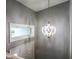 Hallway with decorative chandelier and transom window at 9505 Bay Vista W Dr, Indianapolis, IN 46250