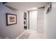 Hallway with tiled flooring and an entrance to the laundry room at 9505 Bay Vista W Dr, Indianapolis, IN 46250