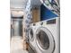 Laundry room with stacked washer and dryer units with an adjacent shower at 9505 Bay Vista W Dr, Indianapolis, IN 46250
