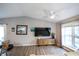 Bright living room with vaulted ceiling features modern furnishings and a large window at 9505 Bay Vista W Dr, Indianapolis, IN 46250
