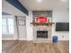 Living room featuring a stone fireplace and built-in display shelving, perfect for entertaining at 9505 Bay Vista W Dr, Indianapolis, IN 46250