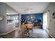 Open concept living space with dining area, updated kitchen, and view of a naturally lit living room at 9505 Bay Vista W Dr, Indianapolis, IN 46250