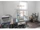 Bright office space with a bird cage and a large window at 9505 Bay Vista W Dr, Indianapolis, IN 46250