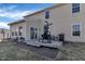 A patio in the backyard with furniture, a grill, a punching bag, and a view of the siding of the house at 10326 Haag Dr, Brownsburg, IN 46112