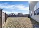 Backyard features a wood fence, green space, a mature tree, and the siding of the house at 10326 Haag Dr, Brownsburg, IN 46112
