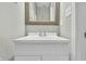 Clean bathroom featuring a white vanity with silver hardware and a framed mirror at 10326 Haag Dr, Brownsburg, IN 46112
