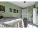 Green bedroom featuring a themed comforter and open access to the upstairs hall at 10326 Haag Dr, Brownsburg, IN 46112