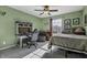 Bedroom featuring a green theme, desk area, and a cozy bed at 10326 Haag Dr, Brownsburg, IN 46112