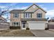 Charming two-story home with a combination of stone and vinyl siding and attached garage at 10326 Haag Dr, Brownsburg, IN 46112