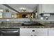Modern kitchen featuring a stainless steel sink, neutral countertops, and white cabinetry at 10326 Haag Dr, Brownsburg, IN 46112