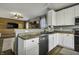 Modern kitchen featuring stainless steel appliances, granite countertops, and an open-concept layout at 10326 Haag Dr, Brownsburg, IN 46112