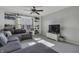 Inviting living room with built-in shelving, large windows, and a comfortable sectional sofa at 10326 Haag Dr, Brownsburg, IN 46112