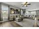 Open-concept living room offering hardwood floors, a plush sectional sofa and ample natural light at 10326 Haag Dr, Brownsburg, IN 46112
