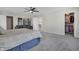 Large main bedroom featuring neutral decor, a cozy seating area, and an open closet at 10326 Haag Dr, Brownsburg, IN 46112