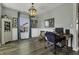 Dedicated work space featuring wood floors, ample light and a charming antique-inspired light fixture at 10326 Haag Dr, Brownsburg, IN 46112