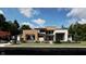 Stunning modern home with light wood accents, lush landscaping, and a manicured lawn at 10440 Somerford Rdg, Zionsville, IN 46077