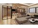 Spacious living area featuring a bar, a pool table, and a comfortable seating area at 10440 Somerford Rdg, Zionsville, IN 46077