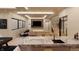 A pool table highlights this expansive living area with bar, comfortable seating, and flatscreen TV at 10440 Somerford Rdg, Zionsville, IN 46077