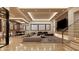 Modern living room with recessed lighting, a comfortable sectional sofa, and a flatscreen television at 10440 Somerford Rdg, Zionsville, IN 46077
