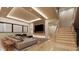Open-concept living area boasts modern finishes, a fireplace, and easy access to the staircase at 10440 Somerford Rdg, Zionsville, IN 46077
