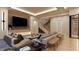 Bright living room showcasing wood floors, a modern fireplace, and a staircase to the upper level at 10440 Somerford Rdg, Zionsville, IN 46077