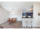 Bright and airy dining area adjacent to the kitchen featuring a convenient breakfast bar at 1057 Timber Creek Dr # 12, Carmel, IN 46032