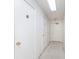 This is a hallway with numbered apartment doors and an exit sign at 1057 Timber Creek Dr # 12, Carmel, IN 46032