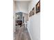 Hallway leads to a living area with seating, dining, and wall decor at 1057 Timber Creek Dr # 12, Carmel, IN 46032