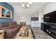 Open-concept living space that features a dining area, kitchen with a breakfast bar, and entertainment center at 1057 Timber Creek Dr # 12, Carmel, IN 46032