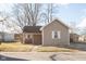 Charming single-story home with neutral siding, covered porch, and bench, offering a cozy and inviting curb appeal at 108 N Maple St, Pittsboro, IN 46167