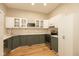 Well-lit kitchen featuring two-tone cabinets, modern appliances, and ample counter space for cooking and entertaining at 108 N Maple St, Pittsboro, IN 46167