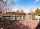 Spacious back deck with wood railing offers an ideal place for outdoor living and entertaining at 10831 Canoe Ct, Indianapolis, IN 46236