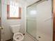 Bathroom features a walk-in shower with sliding glass door at 10831 Canoe Ct, Indianapolis, IN 46236