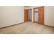Bedroom featuring neutral carpet with closet and wood trim around the base of the room at 10831 Canoe Ct, Indianapolis, IN 46236