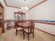 Traditional dining room with a china cabinet, chandelier, and a neutral color palette at 10831 Canoe Ct, Indianapolis, IN 46236