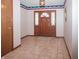 Welcoming entryway with tile flooring, front door with sidelights, and natural light at 10831 Canoe Ct, Indianapolis, IN 46236