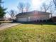 Detached two-car garage with stone exterior offers ample parking and curb appeal at 10831 Canoe Ct, Indianapolis, IN 46236